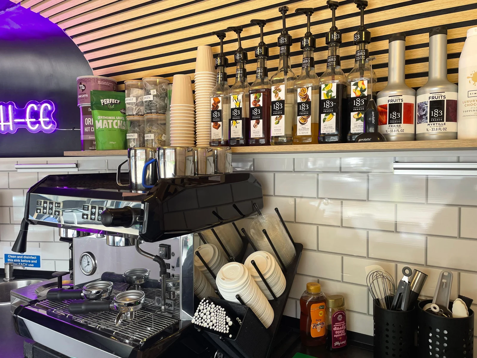 Our coffee machine and syrups inside the horsebox